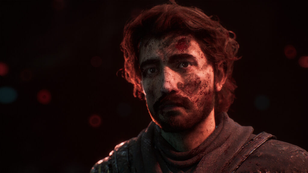 Screenshot aus Clair Obscur: Expedition 33. Gustave ein Mitdreißger mit lockigem halblangem braunem Haar blickt mit blut- und dreckverschmiertem Gesicht links an der Kamera vorbei ins Off. Der Hintergrund ist monochrom schwarz. Es gibt vereinzelte rote unscharfe Lichtpunkte.